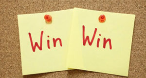 Two sticky notes that read "Win" next to each other. 