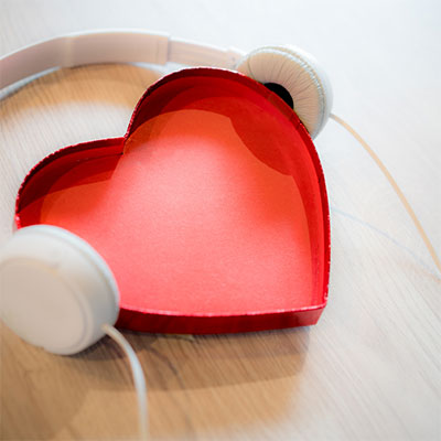 Image of heart-shaped box with headphones on.
